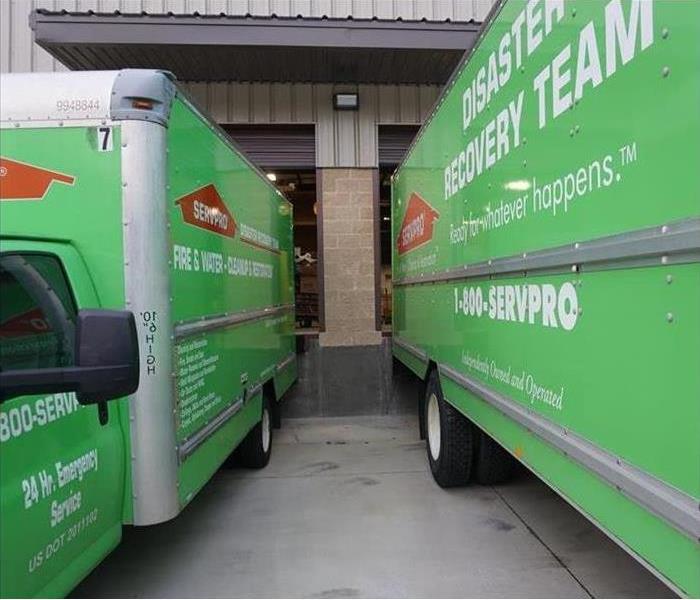 Two SERVPRO trucks backed into the warehouse.