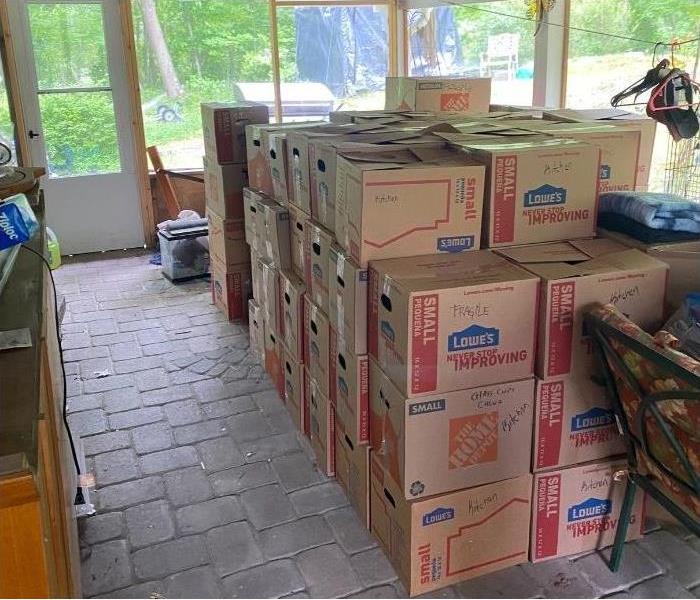 A stack of boxes to be moved after a fire in an Albany home.